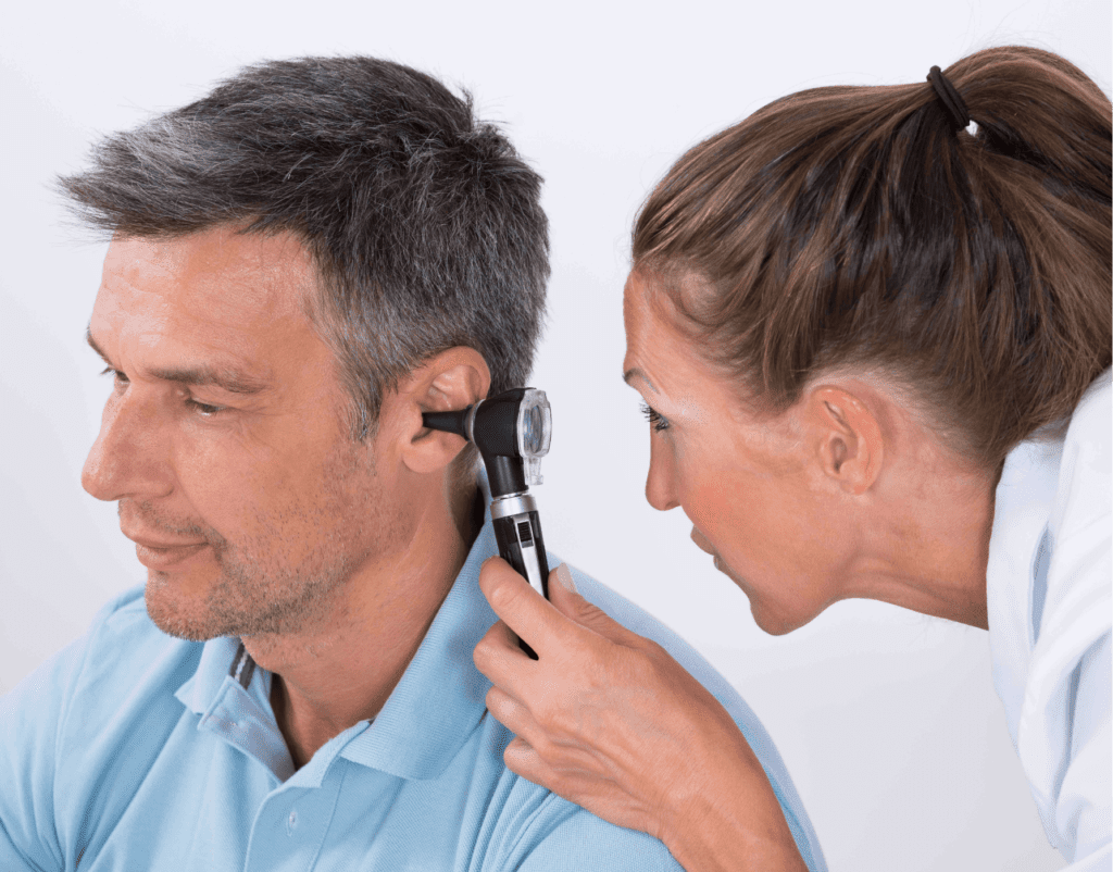 Man getting his ear examined