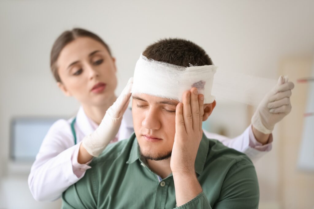 Man at doctor for concussion 