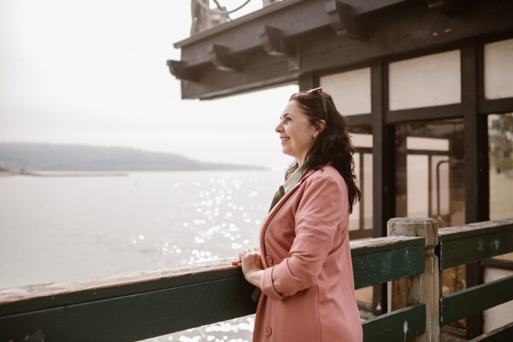 Woman smiling looking at the water
