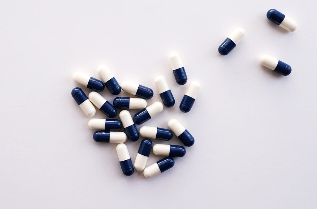 Loose pills on a white surface