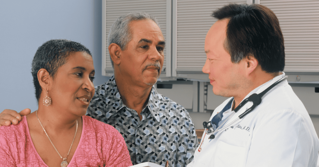 Couple speaking with a doctor