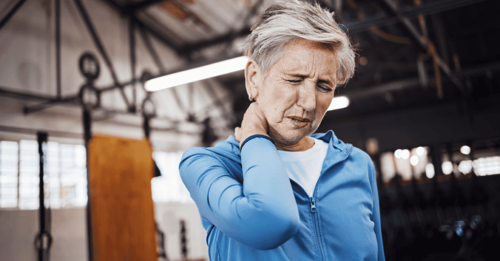 Woman holding her neck in pain