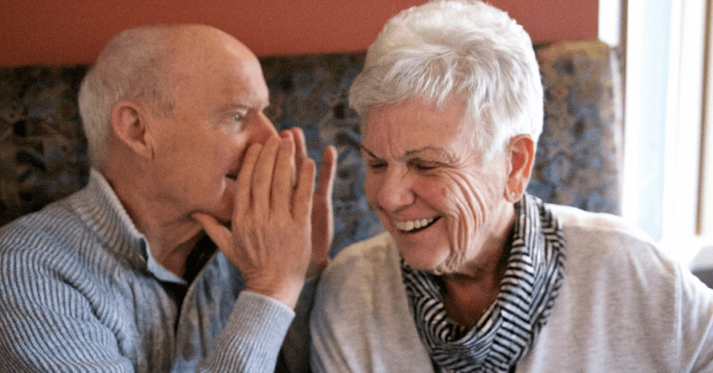 Older man and woman speaking to each other