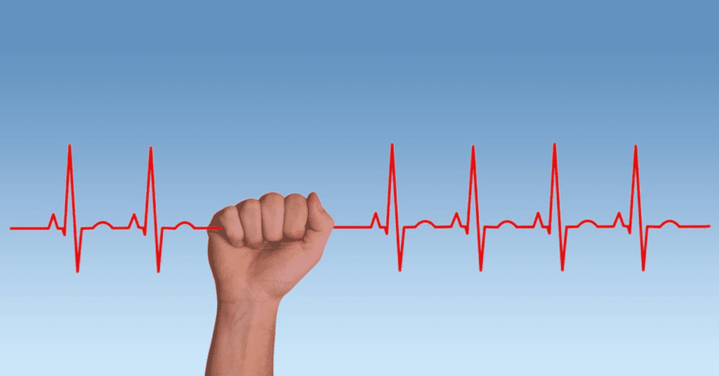 Hand holding an EKG line