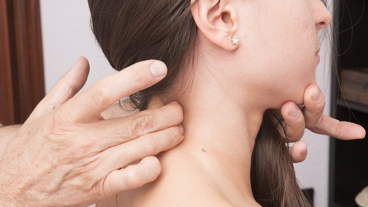 Woman getting her neck adjusted at the chiropractor 