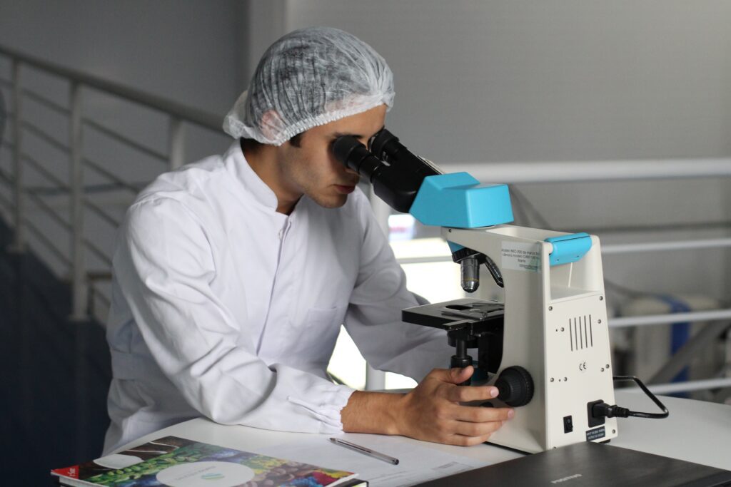 Scientist looking into a microscope 