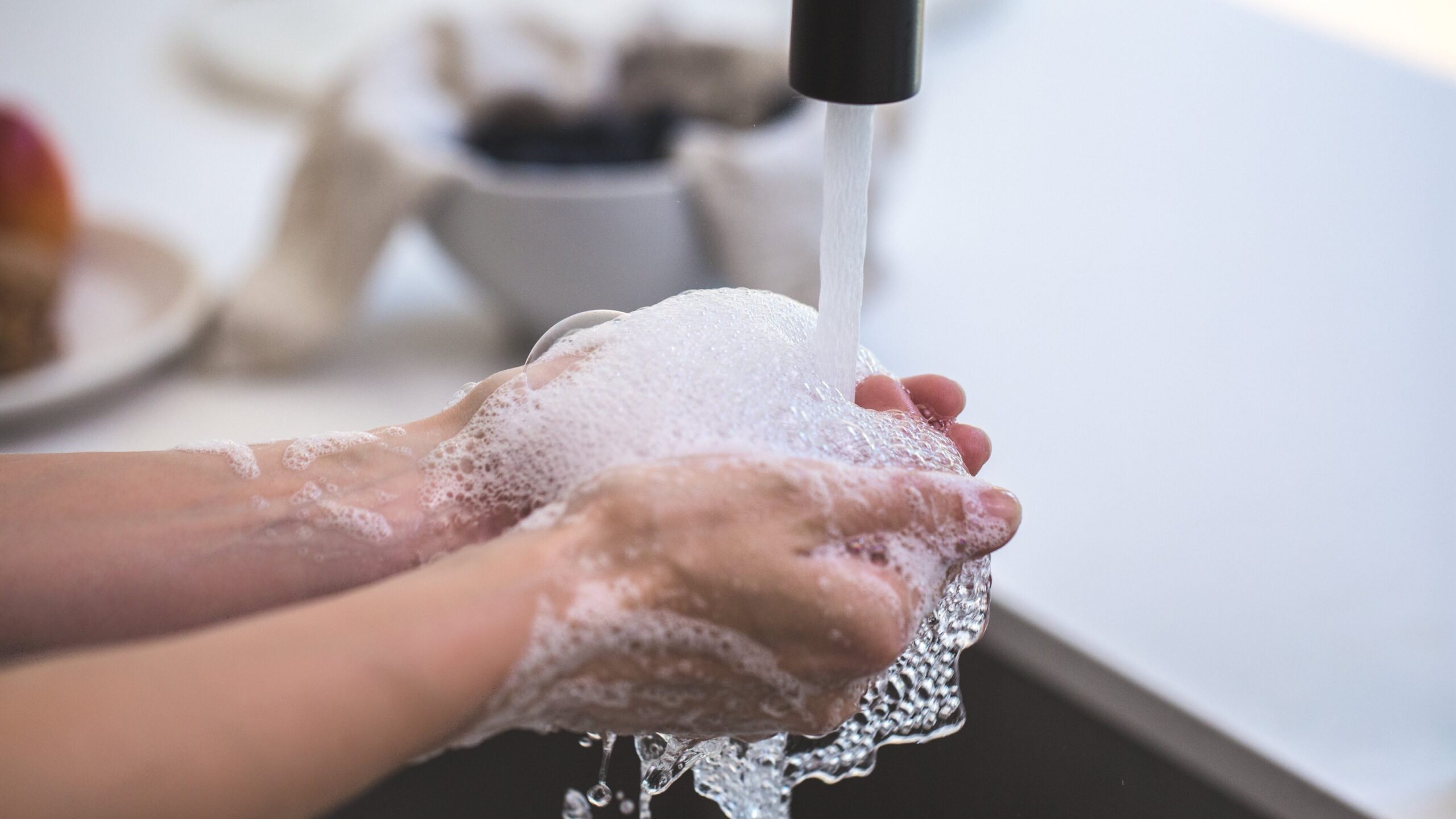 Person washing their hands 