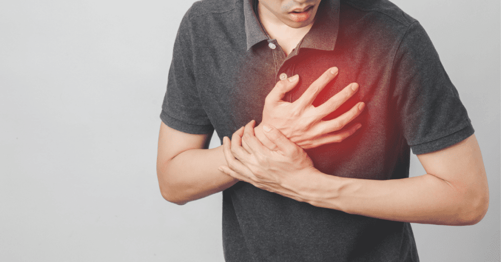 Man holding his heart in pain