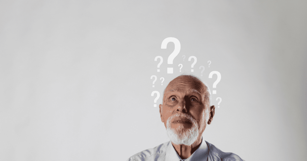 Confused man with question marks above his head