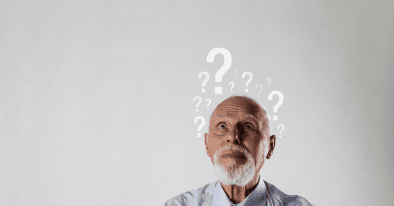 Confused man with question marks above his head