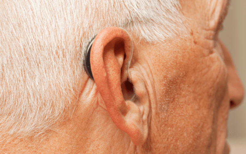 Man wearing an almost invisible hearing aid