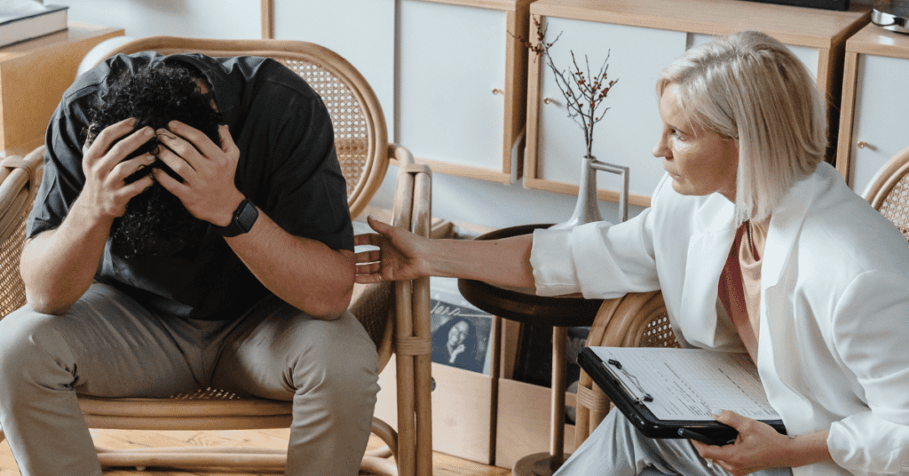 Stressed out man that is talking to his doctor