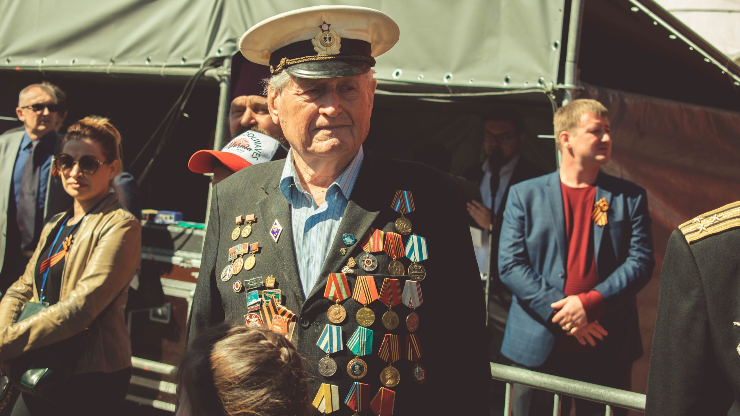 Older veteran covered in pins