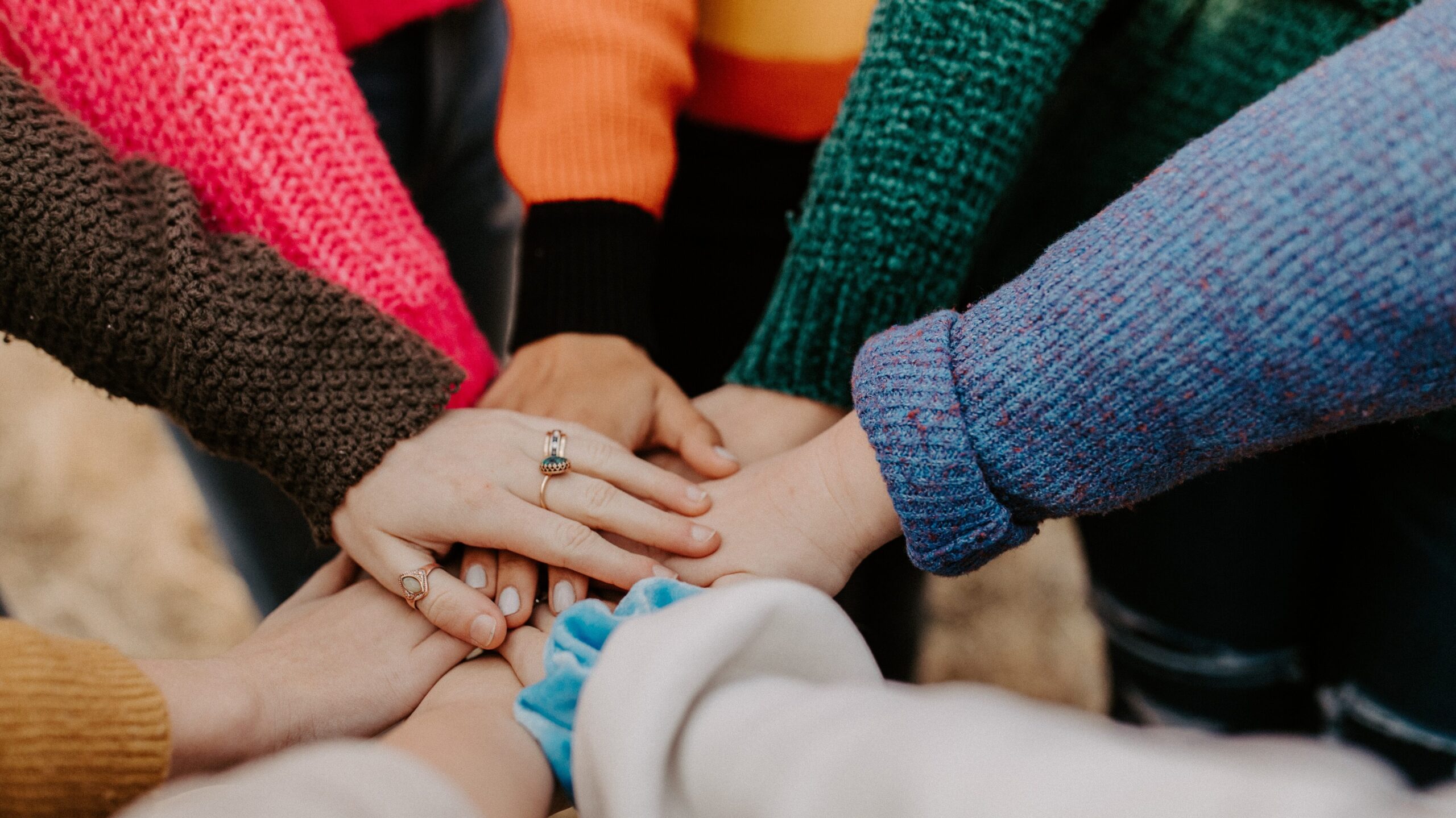 Support group members holding hands