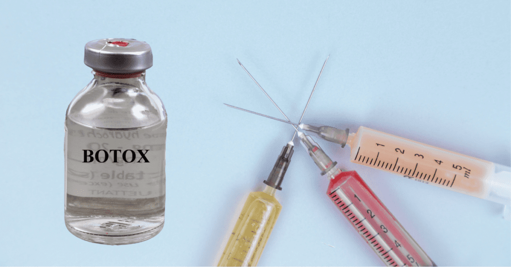 Bottle of Botox next to syringes