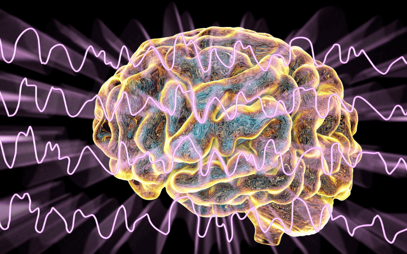 Diagram of the brain with sound waves going over the front 