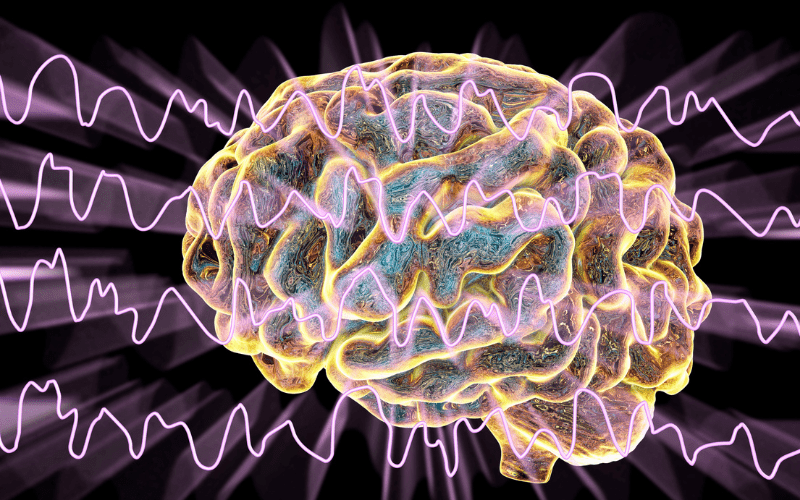 Diagram of the brain with sound waves going over the front