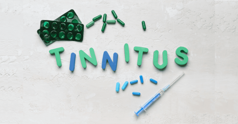 Letters that spell the word tinnitus with pills surrounding it