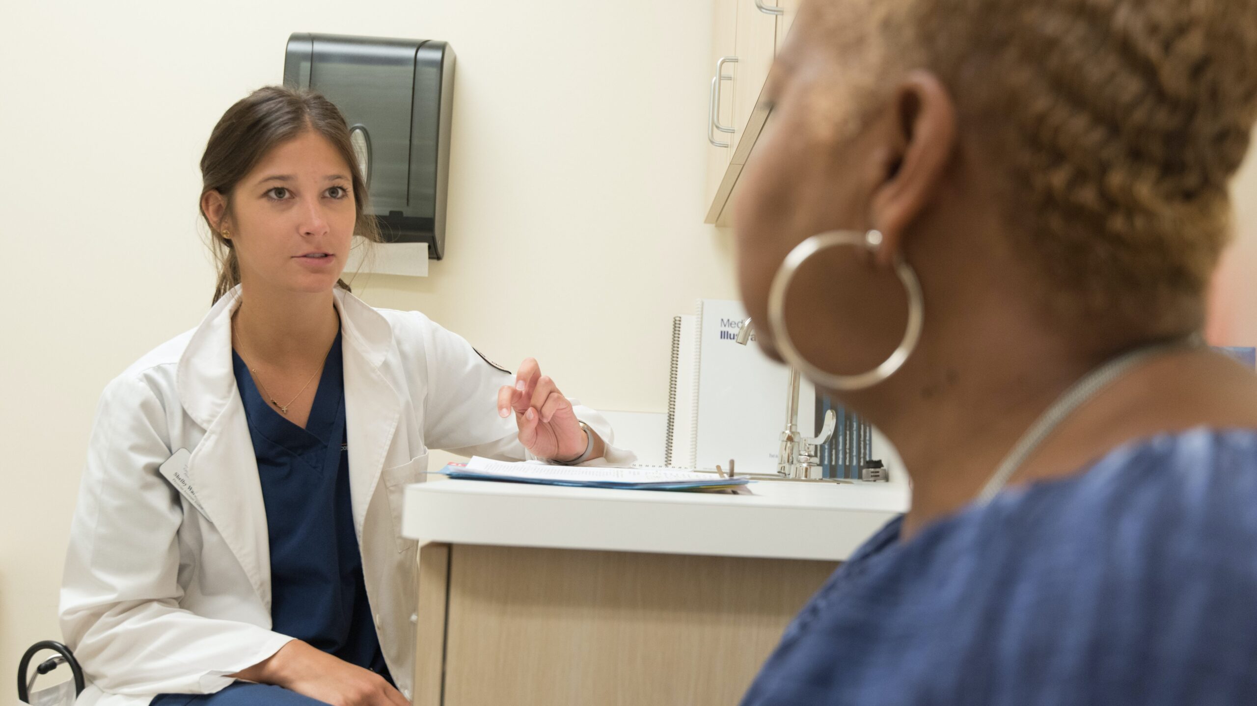 Woman speaking with her doctor