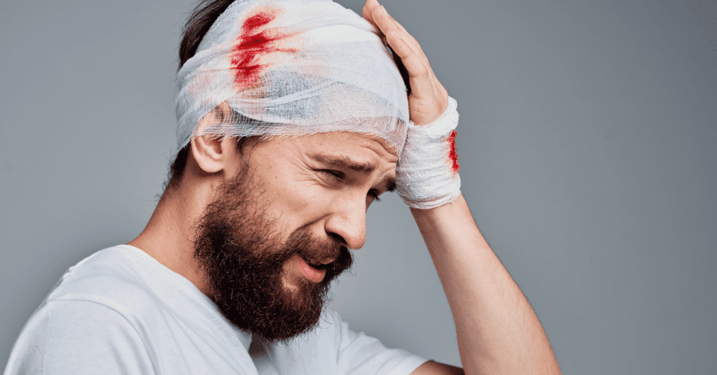 Man with a bandage around his head