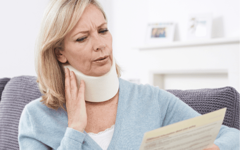 Woman with a neck injury wearing a neck brace