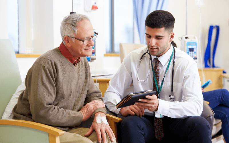 Older man speaking with his doctor